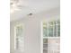 Bright bedroom with neutral walls, ceiling fan, and two large windows at 2049 Town Square Dr, Mcdonough, GA 30253