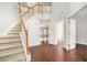 Two-story entryway with hardwood floors, staircase, and views to other rooms at 2049 Town Square Dr, Mcdonough, GA 30253