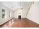 Gathering room with hardwood floors, fireplace and a view into kitchen at 2049 Town Square Dr, Mcdonough, GA 30253