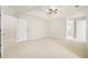 Main bedroom with carpet, ceiling fan, and access to bath at 2049 Town Square Dr, Mcdonough, GA 30253