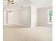 Spacious main bedroom with carpeted floor and large window at 2049 Town Square Dr, Mcdonough, GA 30253