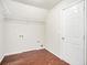 Laundry room with wood-look flooring and ample shelving at 2049 Town Square Dr, Mcdonough, GA 30253