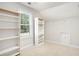 Large walk-in closet with built-in shelving at 2049 Town Square Dr, Mcdonough, GA 30253