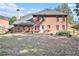 Back of house, brick exterior, and a yard at 2049 Town Square Dr, Mcdonough, GA 30253