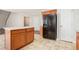 Kitchen island with wood cabinets and tile flooring at 2049 Town Square Dr, Mcdonough, GA 30253