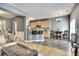 Open kitchen with granite counters, wood cabinets, and breakfast bar at 1798 Willow Branch Nw Ln # F, Kennesaw, GA 30152