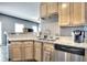 Modern kitchen features granite countertops, light wood cabinets, and stainless steel appliances at 1798 Willow Branch Nw Ln # F, Kennesaw, GA 30152