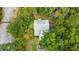 Aerial view of house with green metal roof, surrounded by trees at 268 Arnold Mill Rd, Woodstock, GA 30188