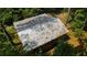 Aerial close-up view of a metal roof showing discoloration and wear at 268 Arnold Mill Rd, Woodstock, GA 30188