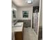 Clean bathroom with a modern vanity, shower, and tiled floor at 268 Arnold Mill Rd, Woodstock, GA 30188