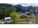 Aerial view of property showing house, shed, and additional land at 268 Arnold Mill Rd, Woodstock, GA 30188