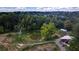 Aerial view of property showing pond, shed and surrounding woods at 268 Arnold Mill Rd, Woodstock, GA 30188