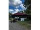 Metal storage shed with tractor and other equipment at 268 Arnold Mill Rd, Woodstock, GA 30188