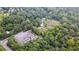 Aerial view of property showing house, pond and large parking area at 268 Arnold Mill Rd, Woodstock, GA 30188