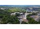 Wide aerial view of a neighborhood with houses, roads, and green spaces at 268 Arnold Mill Rd, Woodstock, GA 30188