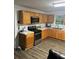 Updated kitchen with wood cabinets and stainless steel appliances at 268 Arnold Mill Rd, Woodstock, GA 30188