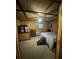 Simple bedroom with wood-paneled walls, carpeted floors and ample closet space at 268 Arnold Mill Rd, Woodstock, GA 30188