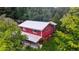 Aerial view of red house with metal roof and large yard at 268 Arnold Mill Rd, Woodstock, GA 30188