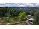 Aerial view of property showing pond, shed, and surrounding trees at 268 Arnold Mill Rd, Woodstock, GA 30188