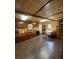Bright kitchen with wood cabinets, laminate flooring, and a dining area at 268 Arnold Mill Rd, Woodstock, GA 30188