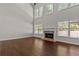 Two story living room with hardwood floors, fireplace and wall of windows at 906 Fox Croft Pl, Canton, GA 30114