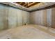 Unfinished basement with concrete floor at 906 Fox Croft Pl, Canton, GA 30114