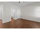 Well-lit bedroom with wood flooring and en-suite bathroom at 906 Fox Croft Pl, Canton, GA 30114
