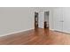 Bedroom with wood floors and access to a full bathroom at 906 Fox Croft Pl, Canton, GA 30114