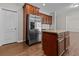 Kitchen boasts an island, granite countertops, and stainless steel refrigerator at 906 Fox Croft Pl, Canton, GA 30114