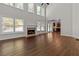 Spacious living room with hardwood floors, fireplace and kitchen views at 906 Fox Croft Pl, Canton, GA 30114