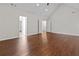 Spacious bonus room with wood flooring and access to bedrooms at 906 Fox Croft Pl, Canton, GA 30114