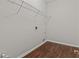 Bright laundry room features ample shelving and vinyl flooring at 906 Fox Croft Pl, Canton, GA 30114