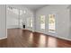 Open dining area with view of Gathering room and backyard at 906 Fox Croft Pl, Canton, GA 30114