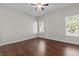 Spacious bedroom with wood-look flooring and ceiling fan at 906 Fox Croft Pl, Canton, GA 30114