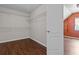 Spacious walk-in closet with wire shelving and wood flooring at 906 Fox Croft Pl, Canton, GA 30114