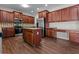 Modern kitchen with stainless steel appliances, granite countertops, and an island at 906 Fox Croft Pl, Canton, GA 30114