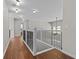 Open upper hallway with wood flooring and iron railing at 906 Fox Croft Pl, Canton, GA 30114