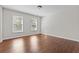 Bright bedroom with wood floors and two windows at 906 Fox Croft Pl, Canton, GA 30114