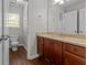 Main bathroom with granite countertop and wood floor at 906 Fox Croft Pl, Canton, GA 30114