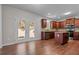 Kitchen with dark wood cabinets, granite countertops, and island at 906 Fox Croft Pl, Canton, GA 30114