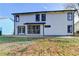 Back exterior view of the house showcasing a patio at 1458#0 Brandon Sqs, Lawrenceville, GA 30044