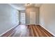 Bright bedroom with wood-look flooring and neutral walls at 1458#0 Brandon Sqs, Lawrenceville, GA 30044