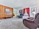 Cozy living room featuring comfortable armchairs and wood paneling at 2560 Walton Sw Way, Marietta, GA 30060