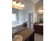 Spacious bathroom with double vanities, large mirrors, and a garden tub at 7025 Fletcher Dr, Winston, GA 30187