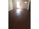 Living room with hardwood floors and lots of natural light at 7025 Fletcher Dr, Winston, GA 30187