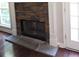 Modern stone fireplace with a dark hearth at 7025 Fletcher Dr, Winston, GA 30187