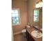 Clean bathroom with neutral colors, a single sink vanity, and tile flooring at 7025 Fletcher Dr, Winston, GA 30187