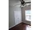 Bedroom with hardwood floors, double doors, and window at 7025 Fletcher Dr, Winston, GA 30187