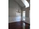 Formal dining room with hardwood floors, wainscoting, and a chandelier at 7025 Fletcher Dr, Winston, GA 30187