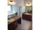Spacious bathroom with double vanities, large mirrors, and a garden tub at 7025 Fletcher Dr, Winston, GA 30187